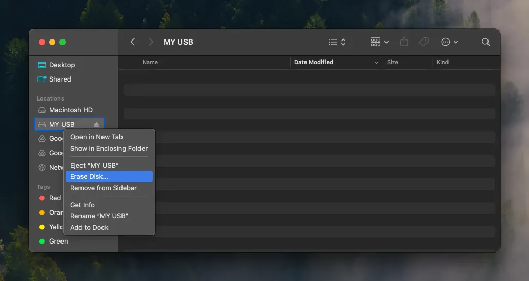A screenshot of a Finder window, with the USB drive highlighted and the "Erase" option hovered